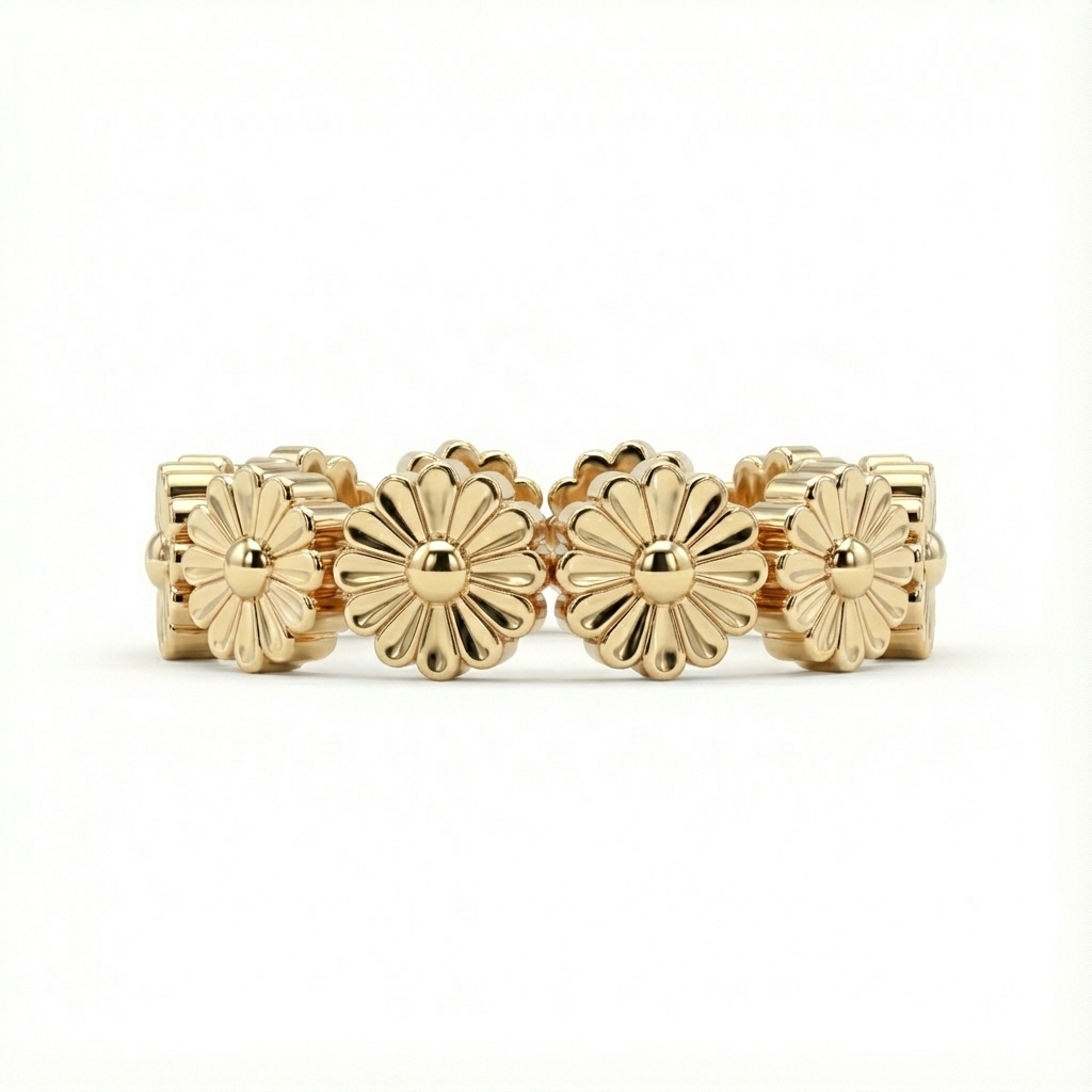 Gold ring with floral designs on a white background